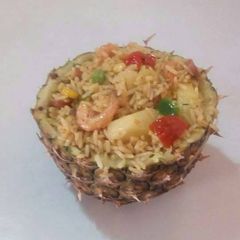A picture of Fried rice in pineapple.