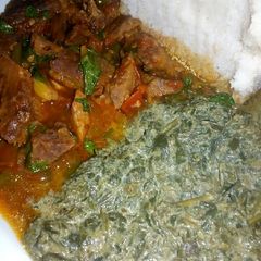 A picture of Wet fried beef,kienyeji veges with ugali.