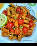 Basil penne pasta in hot tomato sauce