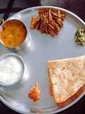 Traditional Maharashtrian Thali. Amti,Chapati,Thecha, Bhendi,Dahi,Gud, Rice