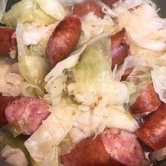 A picture of Cabbage and sausage.