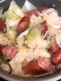 A picture of Cabbage and sausage.
