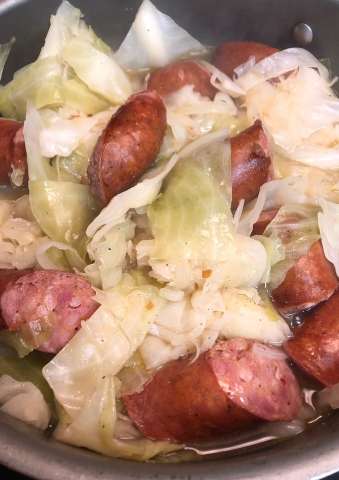 A picture of Cabbage and sausage.