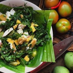 A picture of Ensaladang pako with a bites of salted eggs.