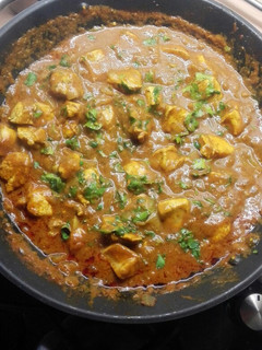 Una foto de Pollo garam masala