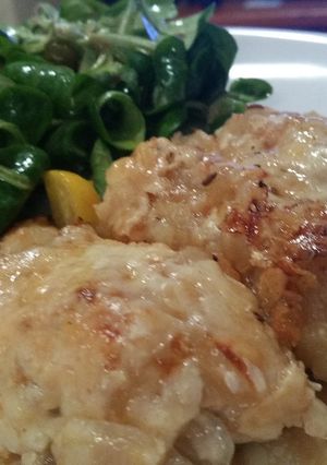 A picture of Chicken fillets with caramalised onion and melted cheese.