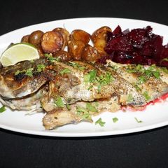 A picture of Griddled sea bass with lime and cilantro butter sauce.