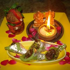 A picture of Gulkand stuffed Pista cones delight.