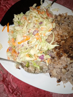 A picture of Rice and beans with coleslaw😋😋😋.