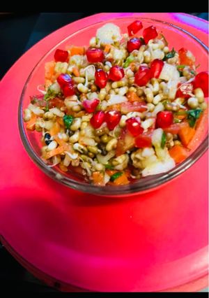 A picture of Sprout Salad with carrots cucumber tomatoes.