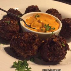 A picture of Crispy Lamb Falafels with chilli cheese sauce.