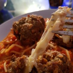 A picture of My Italian meatballs with soft mozzarella cheese inside 😀.