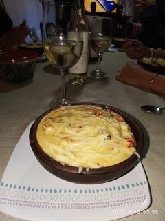 Una foto de Chupé de Mariscos al disco gratinado al Parmesano
