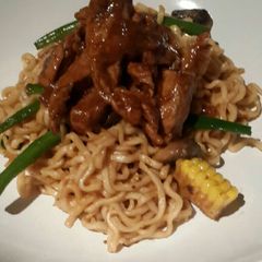 A picture of Sweet n Sour Pork with Fried Noodles.