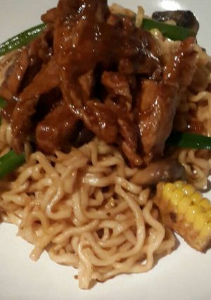 A picture of Sweet n Sour Pork with Fried Noodles.