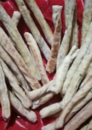 Una foto de Grisines integrales de queso y ajo y perejil