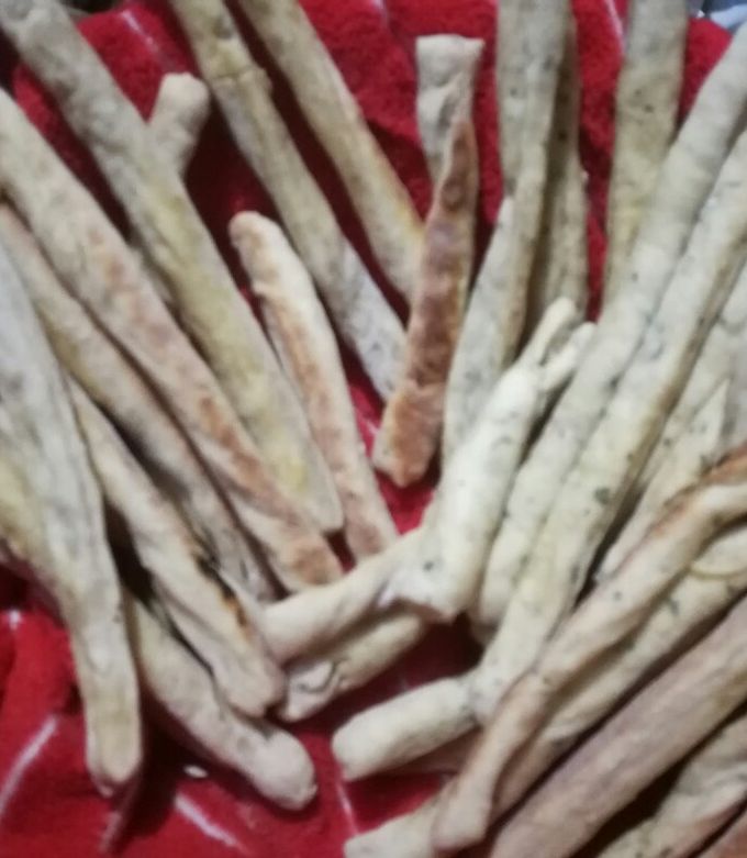 Una foto de Grisines integrales de queso y ajo y perejil