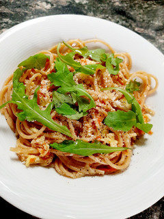 Una foto de Pasta con rúcula