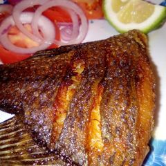 A picture of Deep fried tilapia/kachumbari.