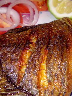 A picture of Deep fried tilapia/kachumbari.