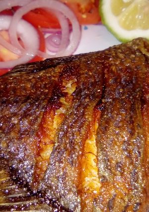 A picture of Deep fried tilapia/kachumbari.