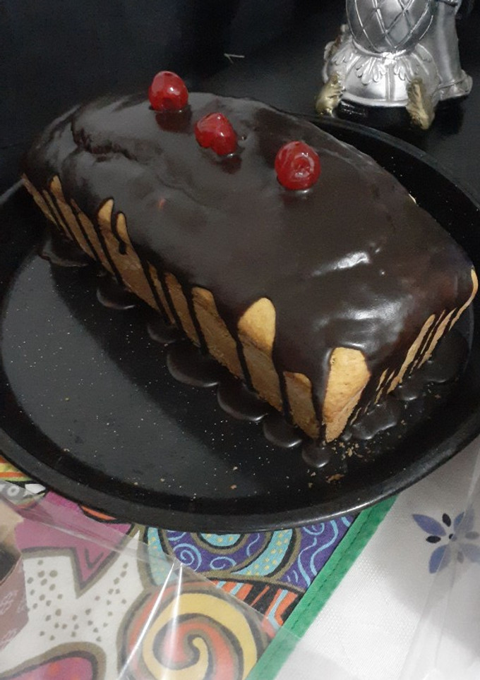 Una foto de Budín de limón con baño de chocolate 🍫🍋