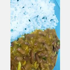 A picture of Rajma with white jeera rice.