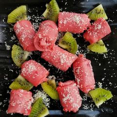 Pink meethi khandvi A picture of Pink meethi khandvi.