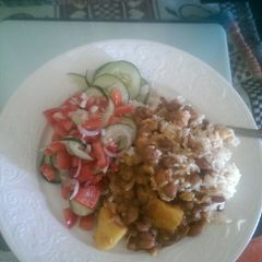 A picture of Rice, beans and salad.
