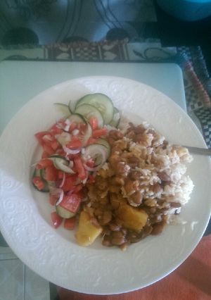 A picture of Rice, beans and salad.