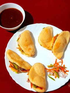 A picture of Noodles Bao Bun With Sweet and Sour Sauce.