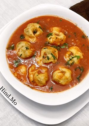 A picture of Shish Barak with Tomato Sauce.