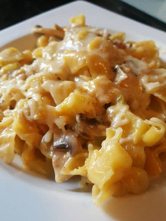 Una foto de Pasta Sacchettini con salsa de champion y calabacín