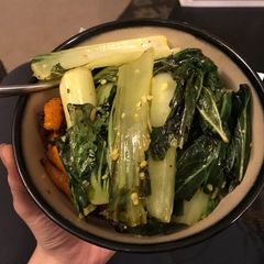 A picture of Bok choy & carrots with wild rice.