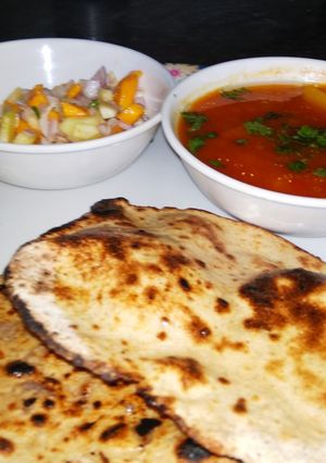 A picture of Lauki Roti(tandoori) with aloo tamatar, karela and salad.