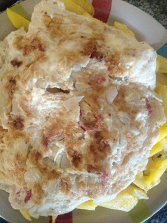 A picture of Chips and egg for breakfast.
