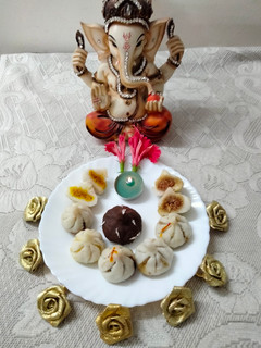 A picture of Handmade traditional modak-dipped in chocolate.