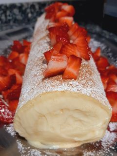 Una foto de Brazo de gitano relleno de crema pastelera