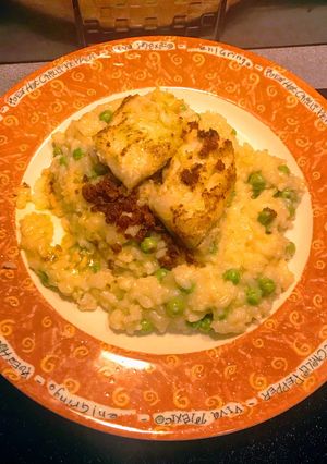 A picture of Cod topped pea Risotto.