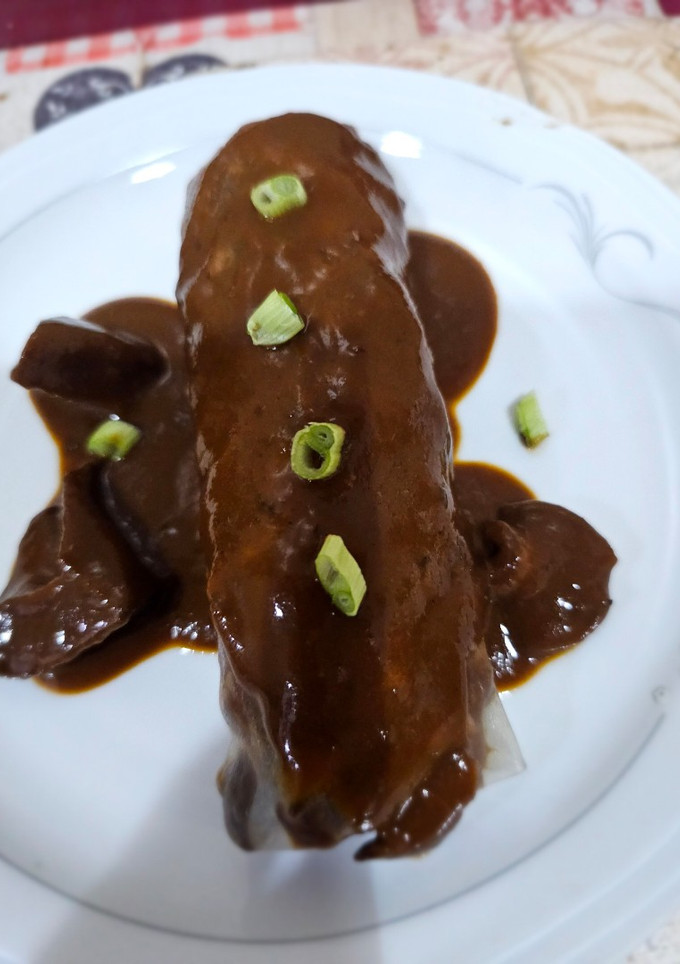 Una foto de Canelón de carrilleras de cerdo al vino tinto con setas de temporada
