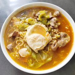 A picture of Instant Noodle with Pork and Egg.
