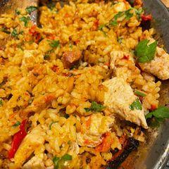 A picture of Chicken and chorizo paella.