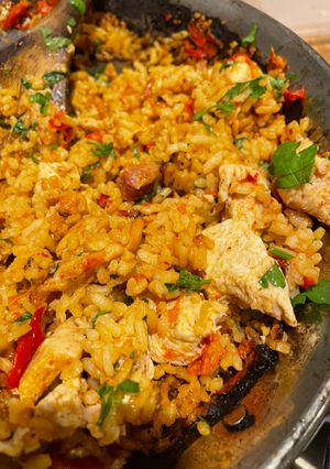 A picture of Chicken and chorizo paella.
