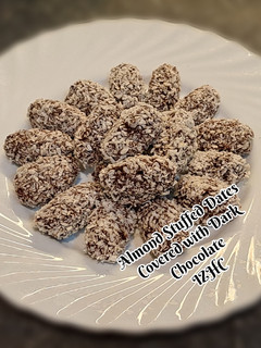 A picture of 🥥🍬🍫Almond Stuffed Dates Covered wit Dark Chocolate🍫🍬🥥.