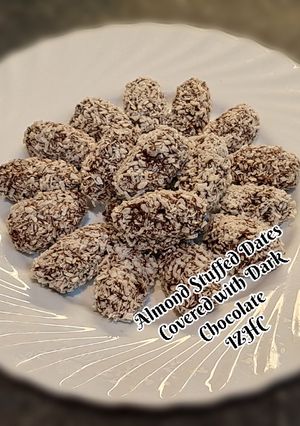 A picture of 🥥🍬🍫Almond Stuffed Dates Covered wit Dark Chocolate🍫🍬🥥.