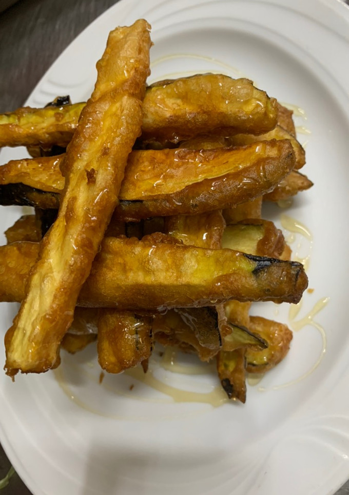Una foto de Berenjenas 🍆 en tempura con miel