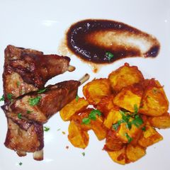 A picture of #week4recipechallenge.Viazi karai,pork chops, tamarind sauce.