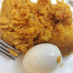 A picture of Yam porriage with boiled egg.