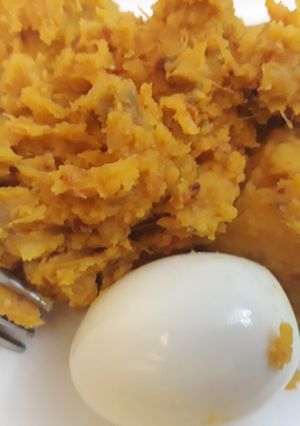 A picture of Yam porriage with boiled egg.