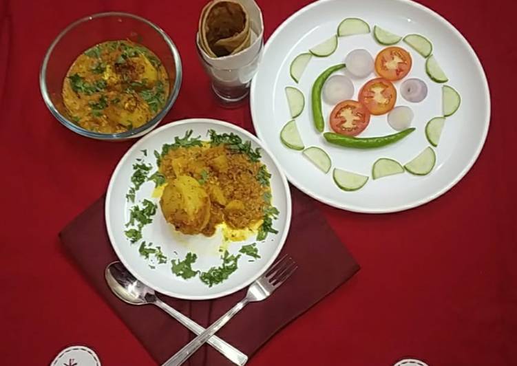 Paneer stuffed potatoes in masala gravy